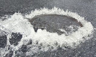 Drain manhole cover overflowing